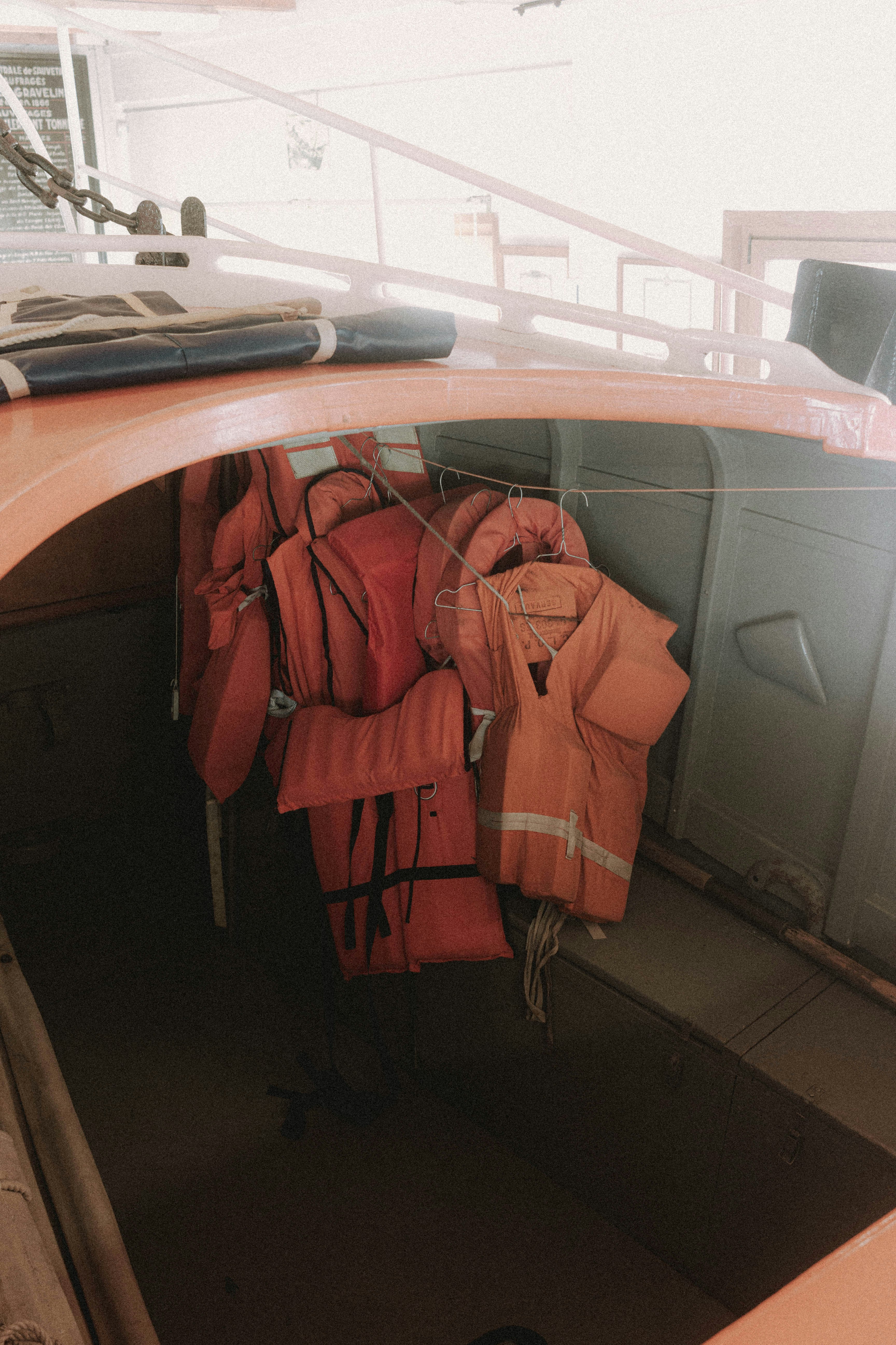 orange jacket on brown wooden desk